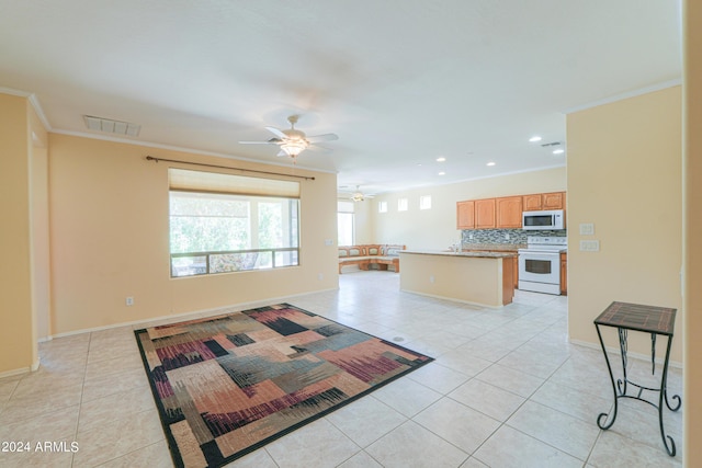 kitchen featuring white appliances, light tile patterned floors, open floor plan, and ornamental molding