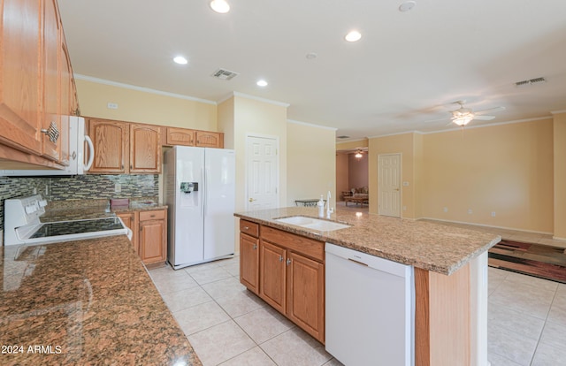 kitchen featuring white appliances, visible vents, ornamental molding, a sink, and light tile patterned flooring