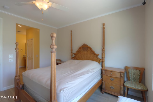 bedroom featuring ornamental molding, baseboards, light wood finished floors, and a ceiling fan