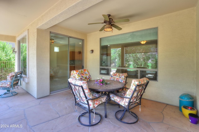 view of patio / terrace featuring outdoor dining area and ceiling fan