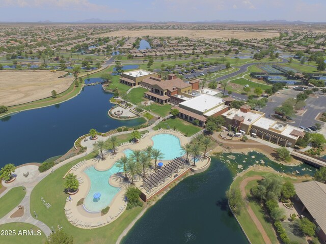 birds eye view of property with a residential view and a water view