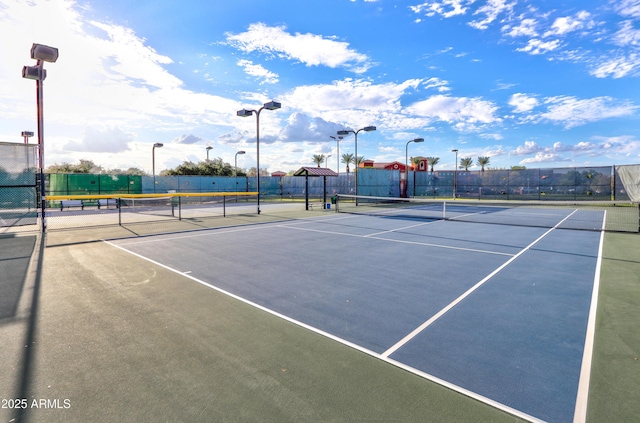 view of sport court with fence