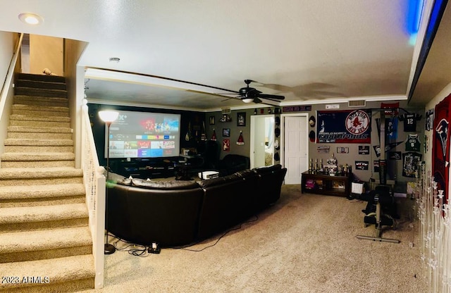 carpeted living room featuring stairway and ceiling fan