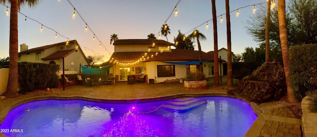 view of swimming pool with a fenced in pool and a patio