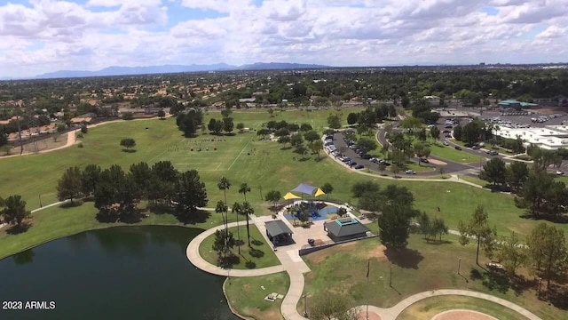 birds eye view of property with a water and mountain view