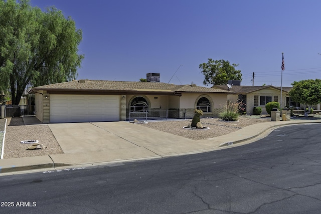 5148 E Edgewood Cir, Mesa, AZ 85206 - ranch-style home with a garage and driveway