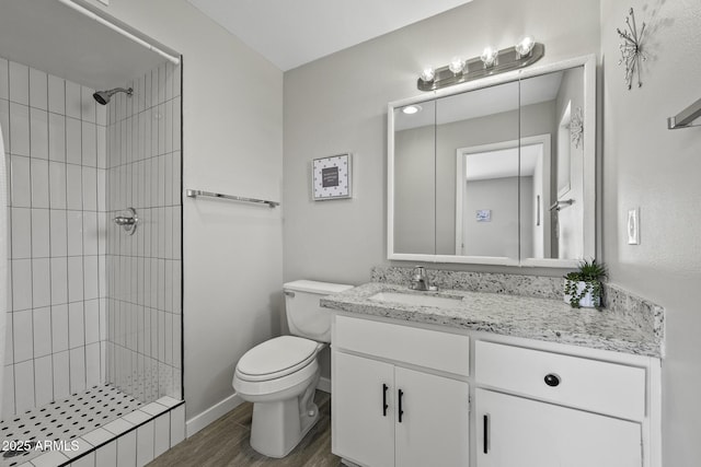 5148 E Edgewood Cir, Mesa, AZ 85206 - bathroom with vanity, tiled shower, and wood finished floors