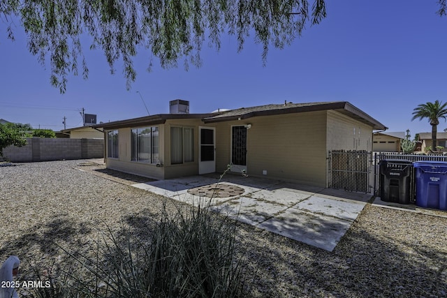 5148 E Edgewood Cir, Mesa, AZ 85206 - rear view of property with a gate, a fenced backyard, and a patio