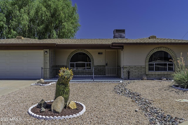 5148 E Edgewood Cir, Mesa, AZ 85206 - ranch-style house featuring an attached garage, driveway, brick siding, a chimney, and a shingled roof