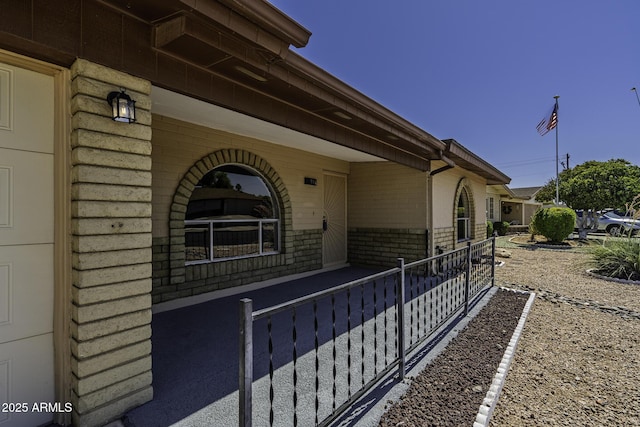 5148 E Edgewood Cir, Mesa, AZ 85206 - view of side of property featuring covered porch and brick siding