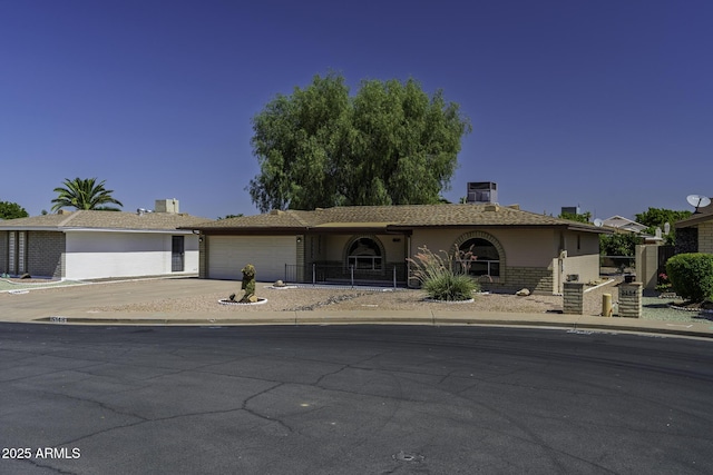 5148 E Edgewood Cir, Mesa, AZ 85206 - ranch-style house featuring a garage and driveway