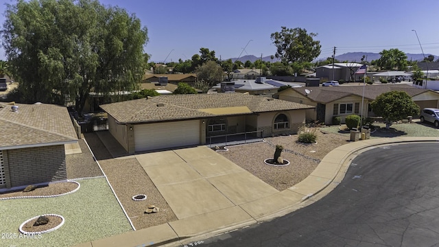 5148 E Edgewood Cir, Mesa, AZ 85206 - single story home featuring an attached garage, concrete driveway, and a residential view