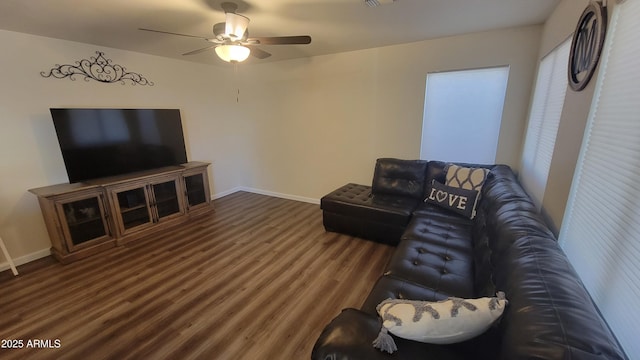 living room featuring wood-type flooring and ceiling fan