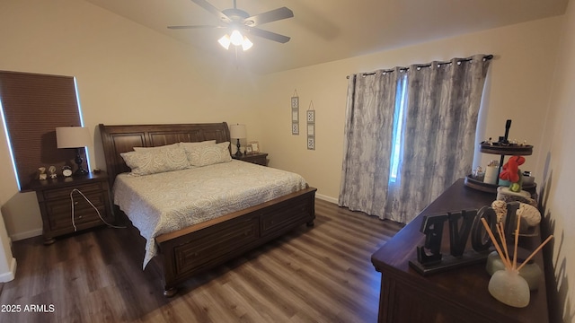 bedroom with lofted ceiling, dark hardwood / wood-style floors, and ceiling fan