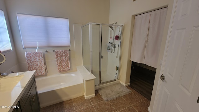 bathroom featuring vanity, tile patterned floors, and independent shower and bath