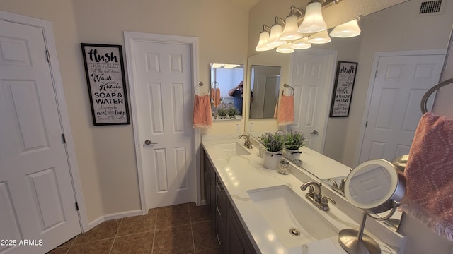 bathroom with tile patterned flooring and vanity