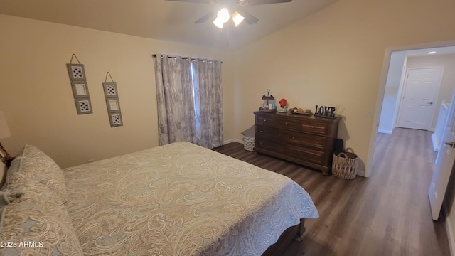 bedroom with lofted ceiling, dark hardwood / wood-style floors, and ceiling fan