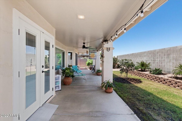 view of patio featuring ceiling fan and french doors