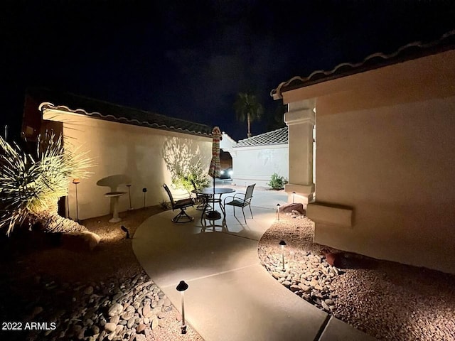 view of patio at twilight