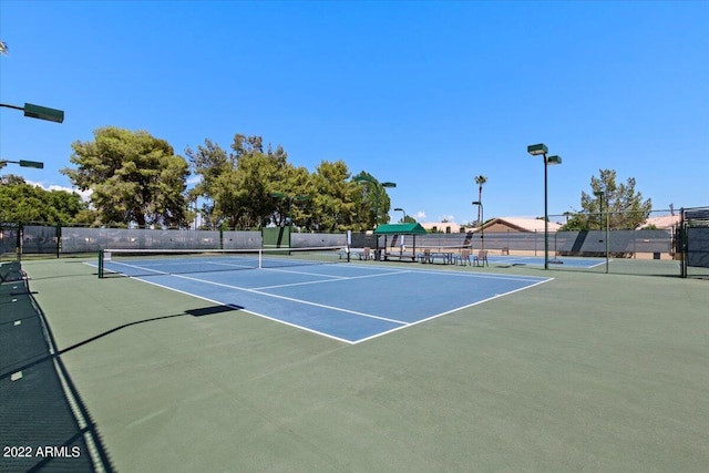 view of sport court with basketball hoop