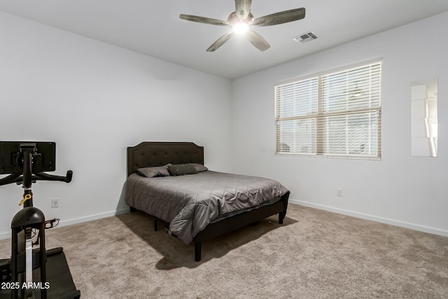carpeted bedroom featuring baseboards, visible vents, and ceiling fan