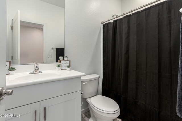 full bathroom with vanity, toilet, and a shower with shower curtain