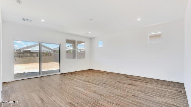 5842 E Axle Ln, San Tan Valley, AZ 85140 - empty room with wood finished floors, baseboards, and recessed lighting