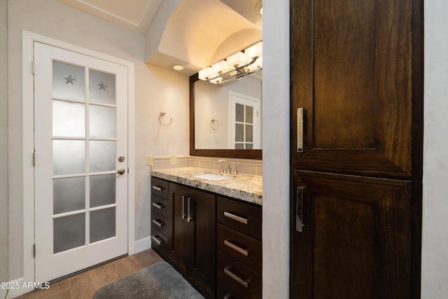 bathroom featuring wood finished floors and vanity