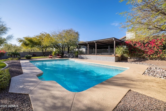 view of swimming pool featuring a fenced backyard and a fenced in pool