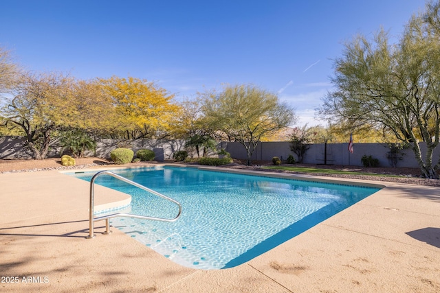 view of swimming pool featuring a fenced backyard and a fenced in pool