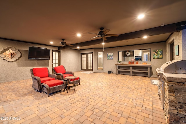 view of patio / terrace with exterior kitchen, french doors, and grilling area