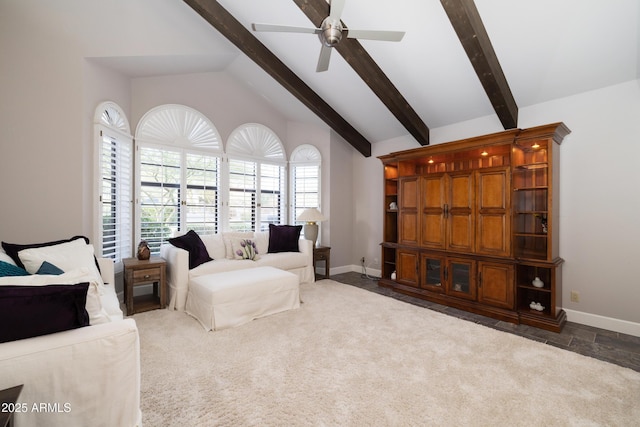 carpeted living room with vaulted ceiling with beams, a ceiling fan, and baseboards