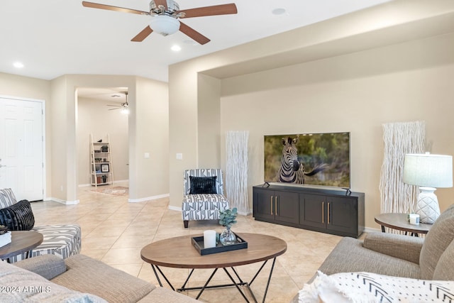 living room featuring ceiling fan and light tile patterned flooring