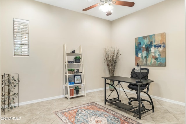 tiled home office featuring ceiling fan