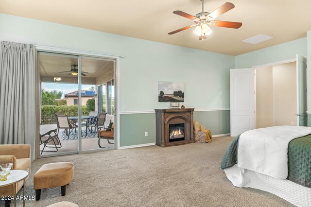 bedroom with carpet floors, access to outside, and ceiling fan