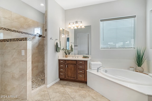 bathroom featuring tile patterned flooring, separate shower and tub, and vanity