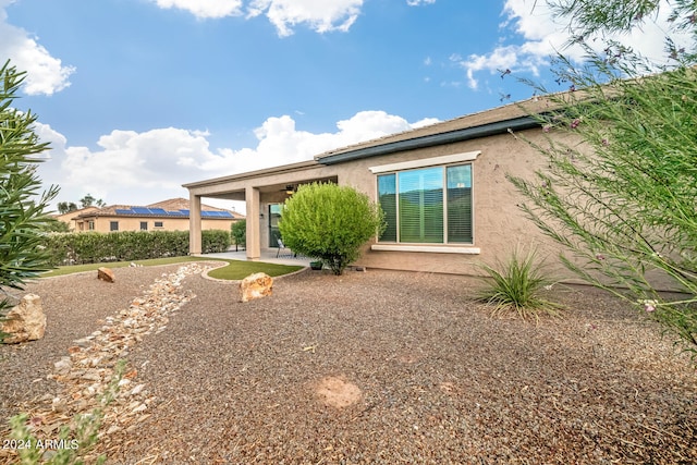 view of side of home featuring a patio