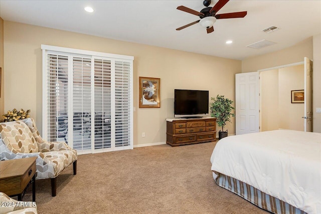 bedroom featuring ceiling fan and light colored carpet