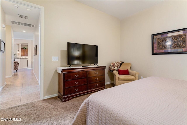 bedroom with light tile patterned floors