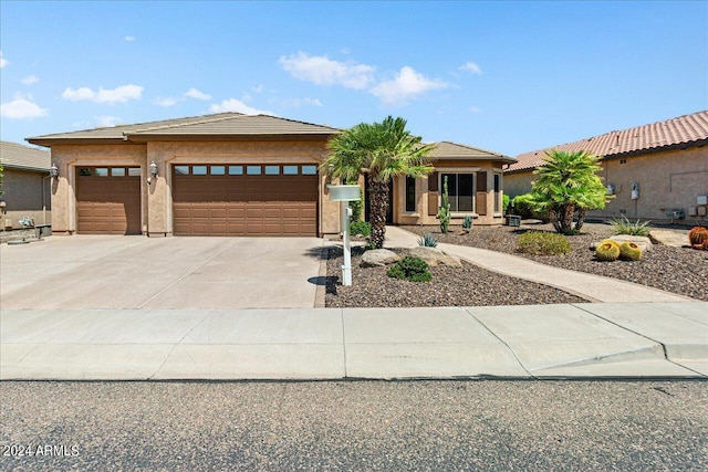 prairie-style home featuring a garage