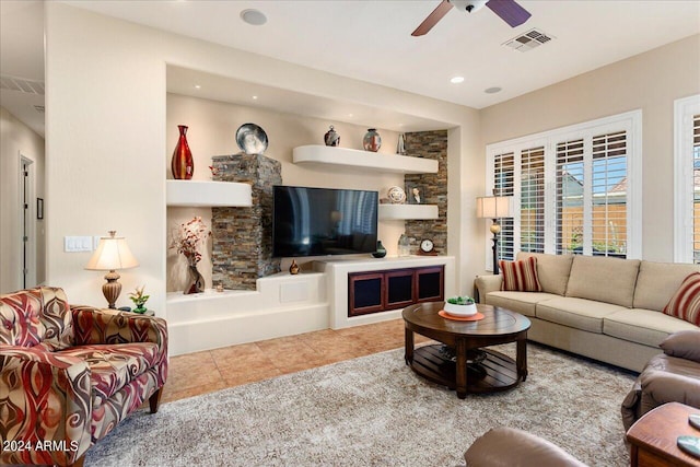 tiled living room featuring ceiling fan