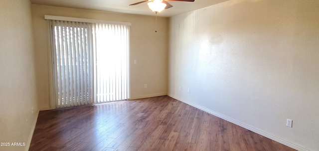 empty room featuring wood-type flooring and ceiling fan