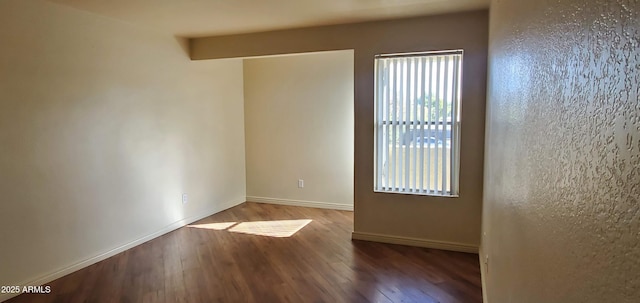 unfurnished room featuring wood-type flooring