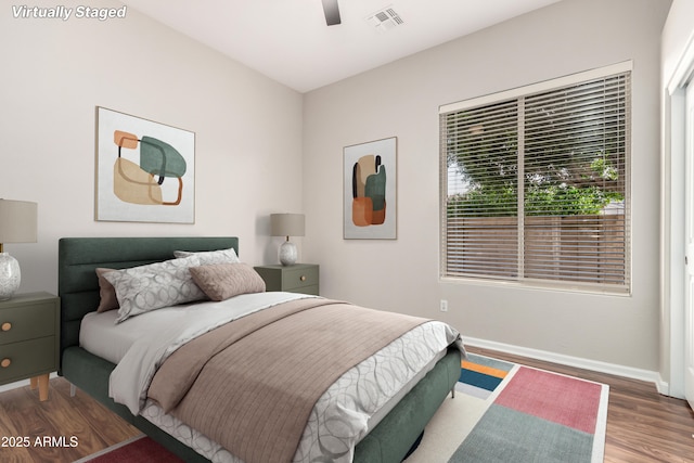4215 W Hackamore Dr, Phoenix, AZ 85083 - bedroom with wood finished floors, baseboards, and a ceiling fan