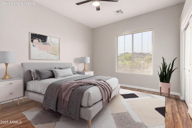 4215 W Hackamore Dr, Phoenix, AZ 85083 - bedroom with wood finished floors, baseboards, and a ceiling fan