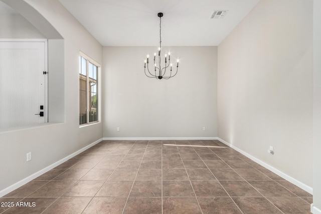 4215 W Hackamore Dr, Phoenix, AZ 85083 - tiled empty room with a chandelier, arched walkways, and baseboards