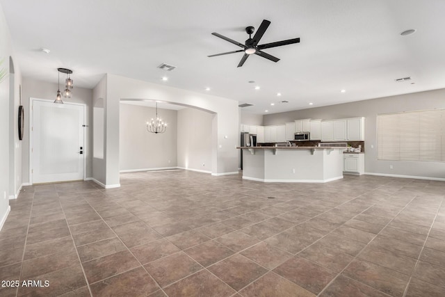 4215 W Hackamore Dr, Phoenix, AZ 85083 - unfurnished living room with ceiling fan, tile patterned flooring, baseboards, and recessed lighting