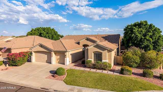 4215 W Hackamore Dr, Phoenix, AZ 85083 - mediterranean / spanish-style home featuring a garage, stucco siding, a tiled roof, concrete driveway, and a gate