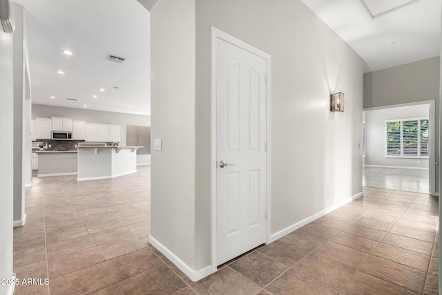 4215 W Hackamore Dr, Phoenix, AZ 85083 - hall with light tile patterned flooring, baseboards, and recessed lighting