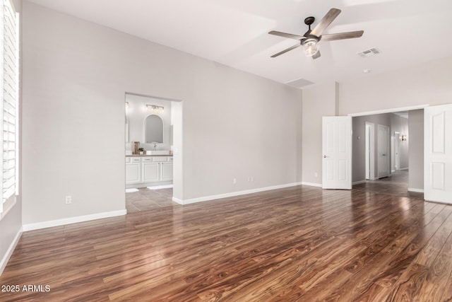4215 W Hackamore Dr, Phoenix, AZ 85083 - empty room with wood finished floors, a ceiling fan, and baseboards